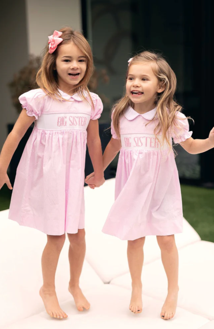 Pink smocked Big Sister dress by Teeta. 
