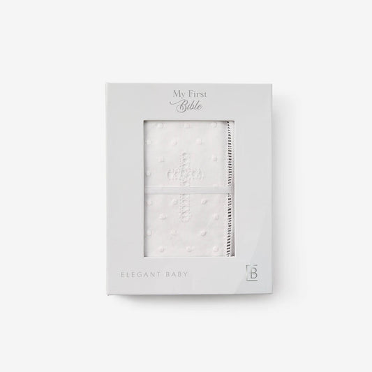 Baby's first bible in a white cover with a cross. 