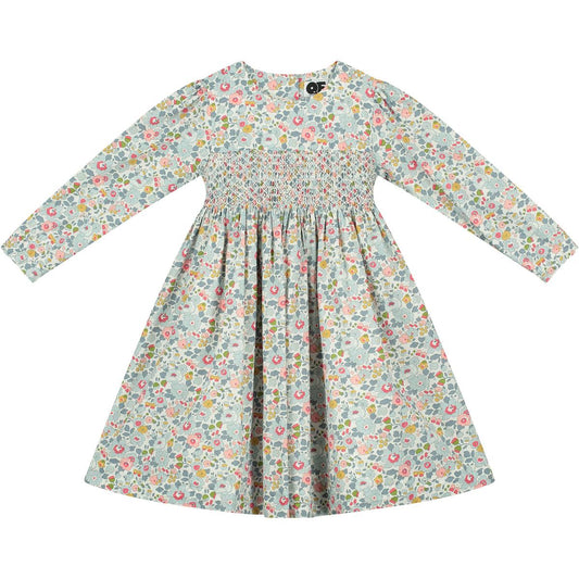 Atlanta Liberty print smocked girls dress by Question Everything in a pastel floral pattern and smocking. 