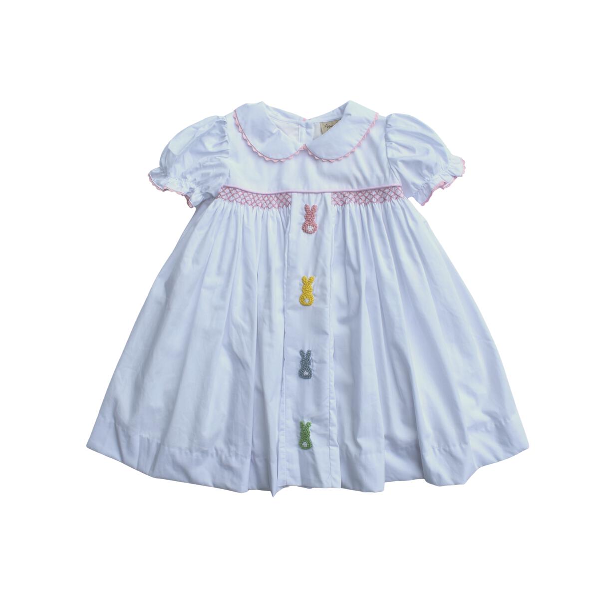 White girls Easter dress with pinpoint embroidered peep Easter bunnies and a smocked chest detail.
