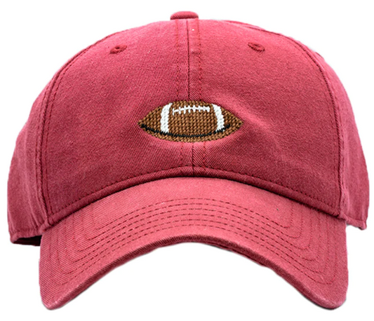 Football on Weathered Red Hat