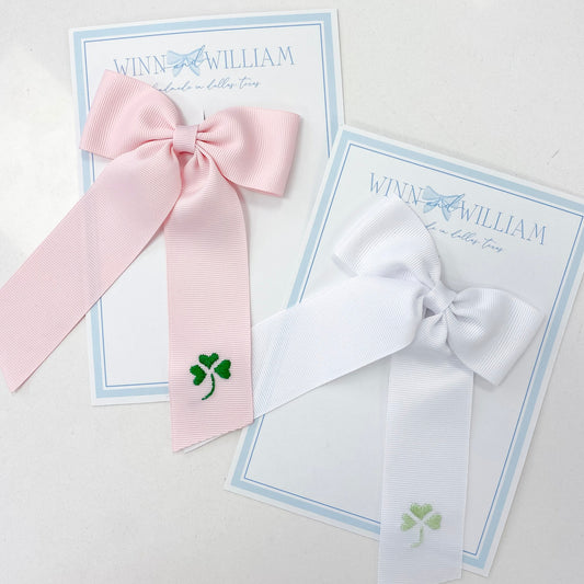 Pink and white bows with green shamrocks by WIinn and William. 