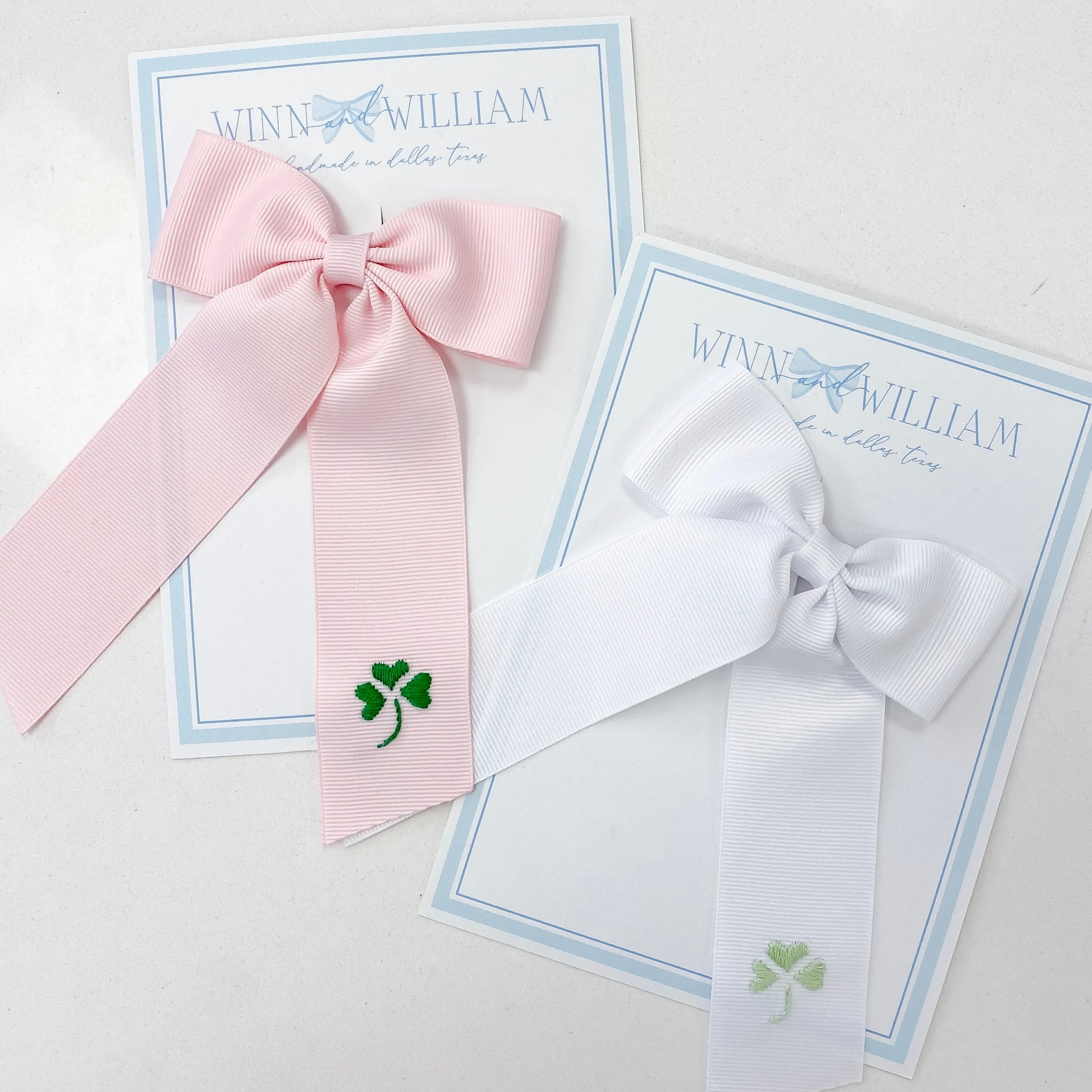 Pink and white bows with green shamrocks by WIinn and William. 